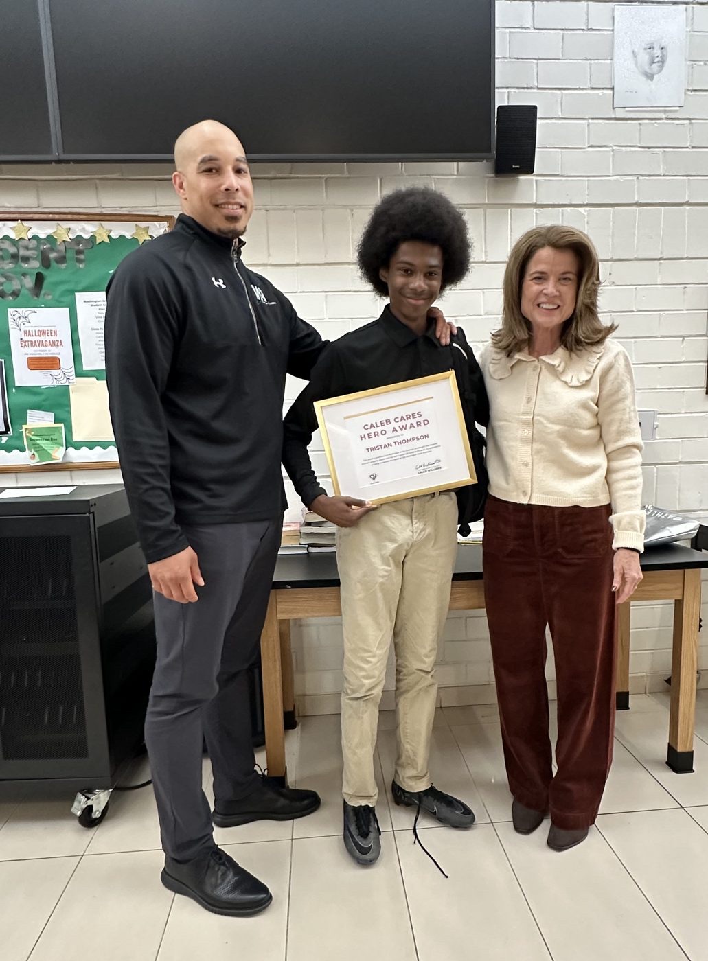 A Caleb Cares Hero Award winner at school